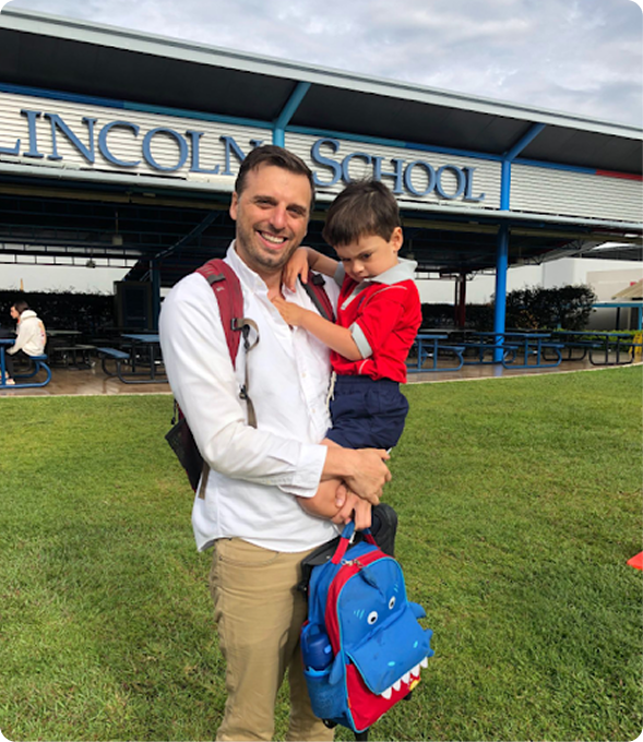 Rob Stauffer with a child at Lincoln School